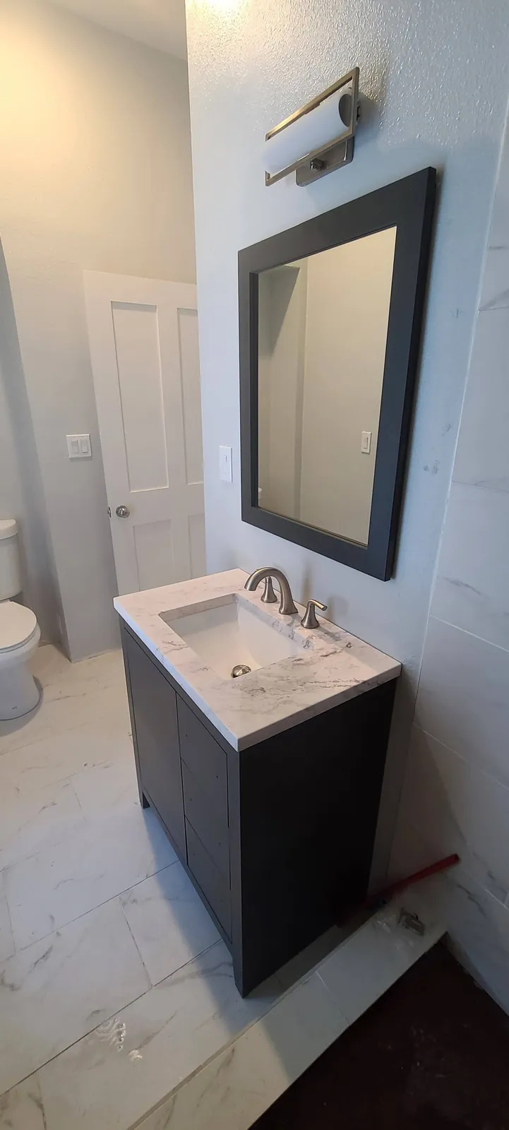 Framed vanity & tile floor