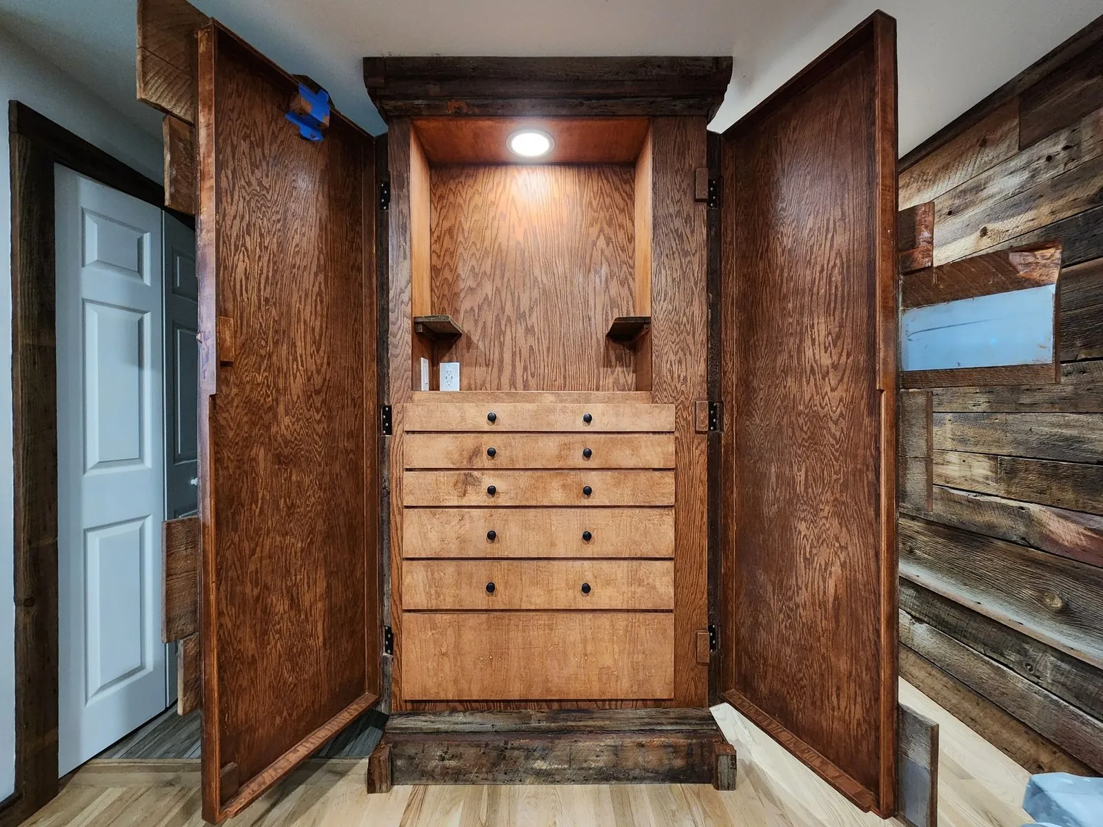 Reclaimed-wood entry built-in by Keystone General Contractors